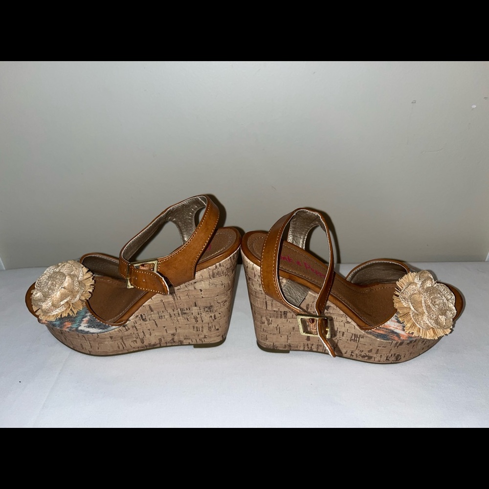 Cork wedge with ankle strap. 5 1/4” heel. Never been worn. So sexy!